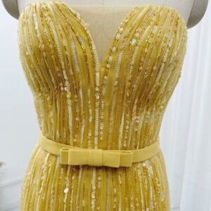 Sweetheart corset bodice detail on golden yellow sequin prom dress