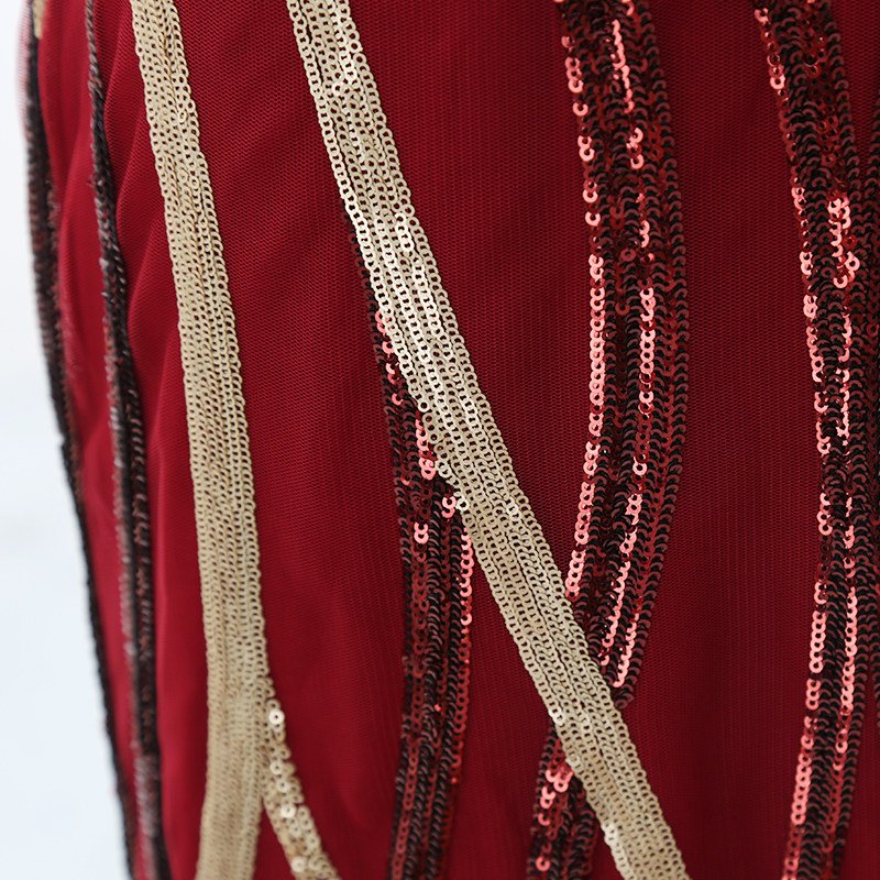 Burgundy and gold geometric sequin embroidery detail